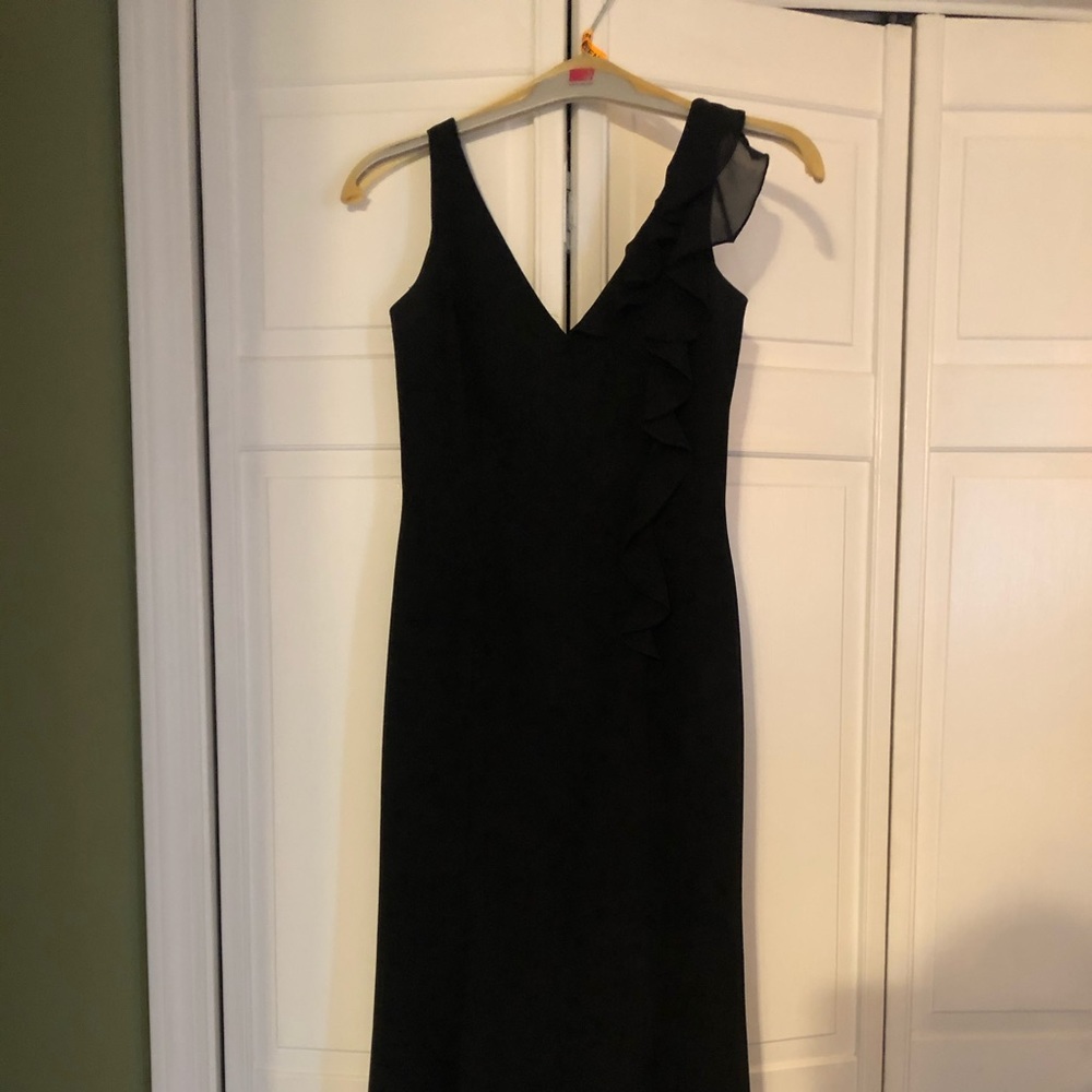 Black cocktail dress with ruffle detail
